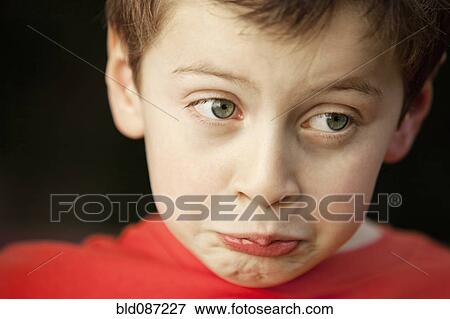 Stock Photo - Pouting Caucasian boy. Fotosearch