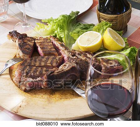 Red wine and Florentine steak View Large Photo Image Stock Image - Red wine and Florentine steak. Fotosearch