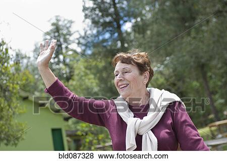 Senior Hispanic woman waving View Large Photo Image Stock Photo - Senior Hispanic woman waving. Fotosearch