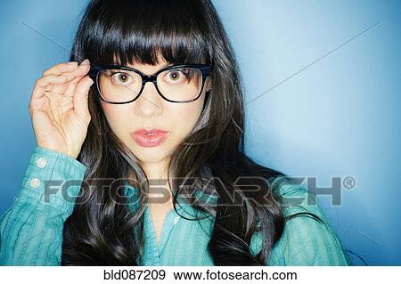 Serious mixed race woman in eyeglasses View Large Photo Image Stock Photo - Serious mixed race woman in eyeglasses. Fotosearch