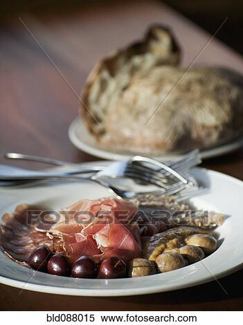 Sliced meat antipasti, olives, prosciutto and salami View Large Photo Image Stock Photography - Sliced meat antipasti, olives, prosciutto and salami. Fotosearch