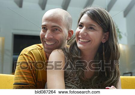 Picture - Smiling couple hugging. Fotosearch