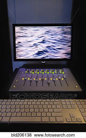 A computer workstation with sound board in a home recording studio View Large Photo Image Stock Photo - A computer workstation with sound board in a home recording studio. Fotosearch