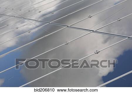 Stock Image - A row of solar panels installed in a rural situation. Fotosearch