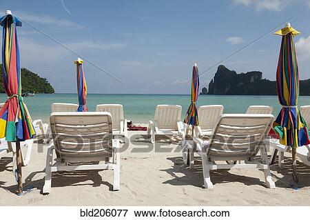 Stock Photo - A view out to sea from the white sand beach. Fotosearch