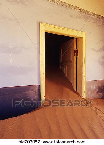Stock Image - Abandoned House Filled with Drifting Sand. Fotosearch