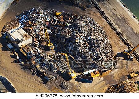 Stock Photography - Aerial view of bulldozers in landfill. Fotosearch