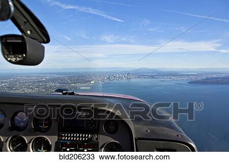 Stock Image - Aerial View Of City On Coast Of Lake. Fotosearch