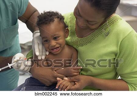 African American baby getting shot at hospital View Large Photo Image Stock Photography - African American baby getting shot at hospital. Fotosearch