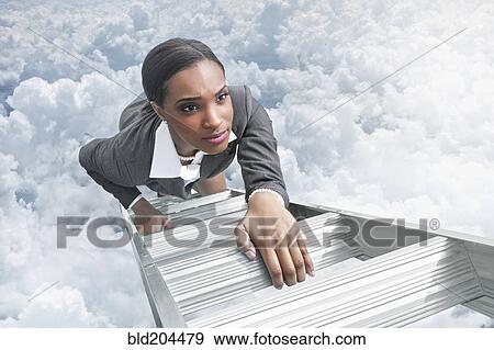 African American businesswoman climbing ladder View Large Photo Image Stock Photo - African American businesswoman climbing ladder. Fotosearch