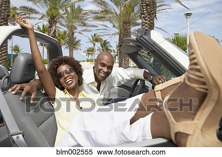 African American couple sitting in convertible View Large Photo Image Stock Photography - African American couple sitting in convertible. Fotosearch