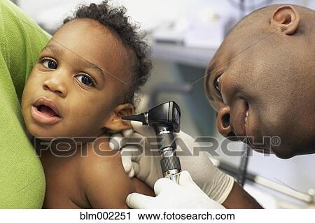 African American doctor examining baby View Large Photo Image Stock Image - African American doctor examining baby. Fotosearch