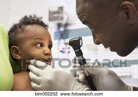 African American doctor examining baby View Large Photo Image Stock Image - African American doctor examining baby. Fotosearch