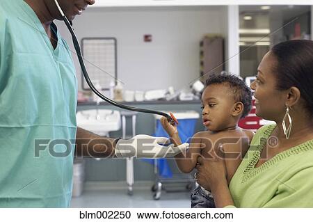 African American doctor talking to mother and baby View Large Photo Image Stock Image - African American doctor talking to mother and baby. Fotosearch