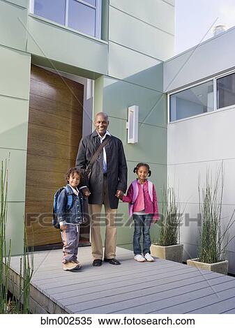 Stock Photography - African American father and children on porch. Fotosearch