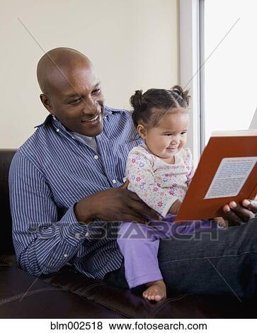 African American father reading to daughter View Large Photo Image Stock Photo - African American father reading to daughter. Fotosearch