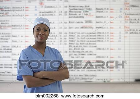 Stock Photo - African American female doctor with arms crossed. Fotosearch