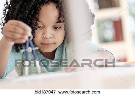 African American girl using compass in science classroom View Large Photo Image Stock Photo - African American girl using compass in science classroom. Fotosearch