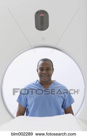 Stock Photo - African American medical professional in front of MRI. Fotosearch