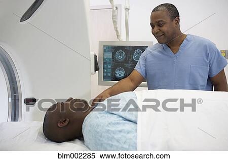Stock Photography - African American medical professional reassuring patient. Fotosearch