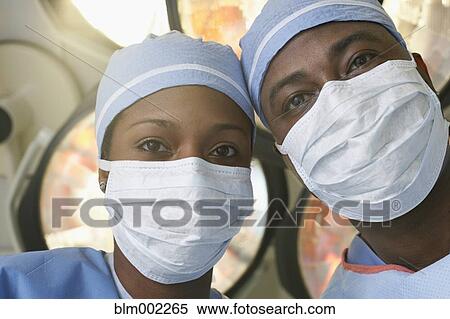 African American medical professionals wearing surgical masks View Large Photo Image Stock Photography - African American medical professionals wearing surgical masks. Fotosearch