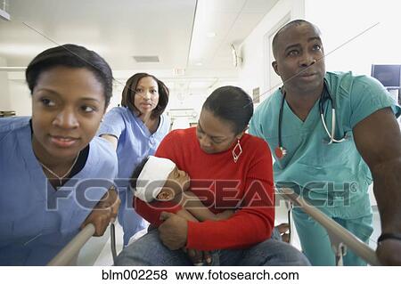 African American mother and baby on hospital gurney View Large Photo Image Stock Photo - African American mother and baby on hospital gurney. Fotosearch