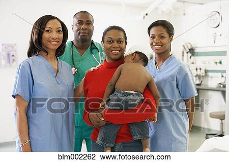 African American mother and baby surrounded by medical professionals View Large Photo Image Stock Image - African American mother and baby surrounded by medical professionals. Fotosearch