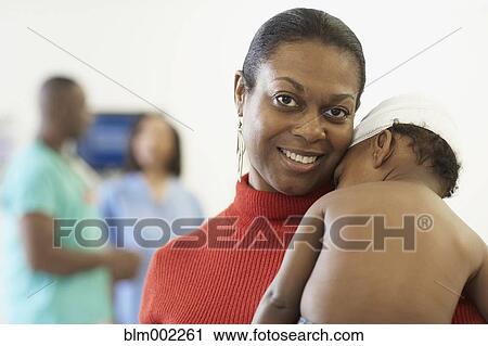 African American mother hugging bandaged baby View Large Photo Image Stock Image - African American mother hugging bandaged baby. Fotosearch