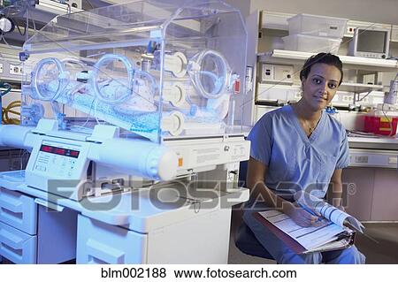 African American nurse writing on chart View Large Photo Image Stock Photo - African American nurse writing on chart. Fotosearch