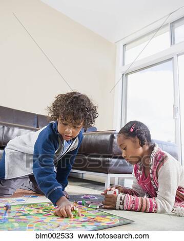 African American siblings playing board game View Large Photo Image Stock Image - African American siblings playing board game. Fotosearch