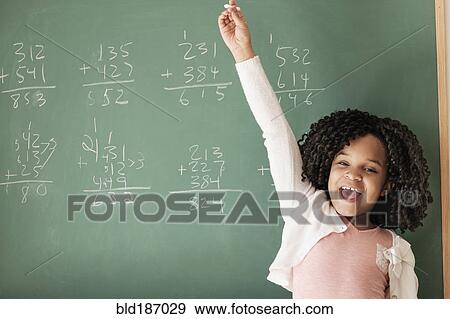 African American student cheering near chalkboard in classroom View Large Photo Image Stock Photo - African American student cheering near chalkboard in classroom. Fotosearch