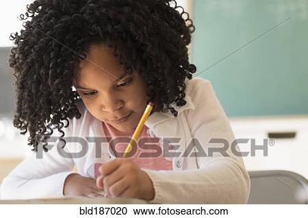 African American student writing in classroom View Large Photo Image Stock Image - African American student writing in classroom. Fotosearch