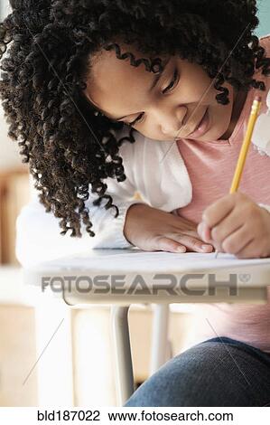 African American student writing in classroom View Large Photo Image Stock Image - African American student writing in classroom. Fotosearch