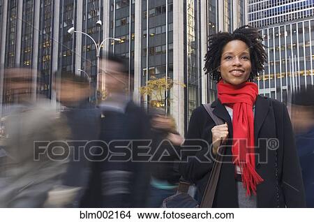 Picture - African American woman in urban scene. Fotosearch