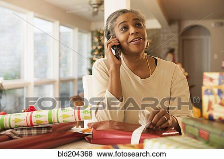 African American woman talking on cell phone View Large Photo Image Stock Photo - African American woman talking on cell phone. Fotosearch