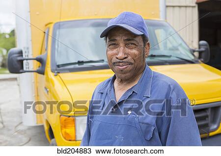 African American worker smiling by truck View Large Photo Image Stock Image - African American worker smiling by truck. Fotosearch