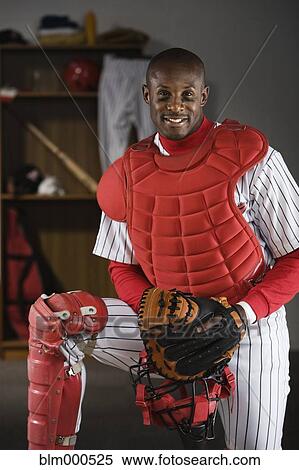African baseball catcher in locker room View Large Photo Image Stock Photography - African baseball catcher in locker room. Fotosearch