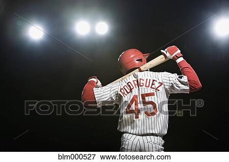 African baseball player holding bat View Large Photo Image Stock Photo - African baseball player holding bat. Fotosearch