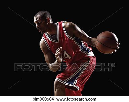 African basketball player holding basketball View Large Photo Image Picture - African basketball player holding basketball. Fotosearch