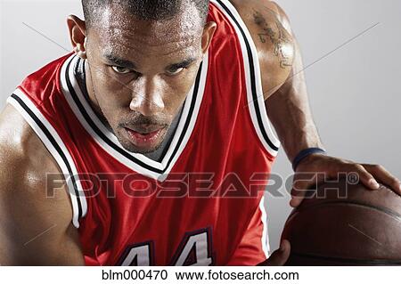 African basketball player holding basketball View Large Photo Image Stock Image - African basketball player holding basketball. Fotosearch