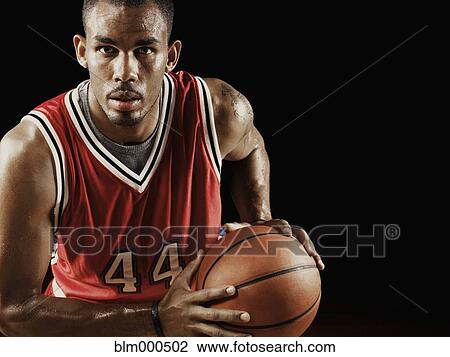 African basketball player holding basketball View Large Photo Image Stock Image - African basketball player holding basketball. Fotosearch