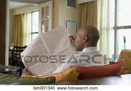 African businessman reading newspaper View Large Photo Image Stock Image - African businessman reading newspaper. Fotosearch