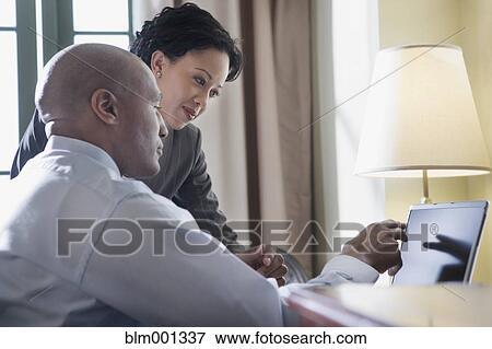 African businesspeople using laptop View Large Photo Image Stock Photo - African businesspeople using laptop. Fotosearch