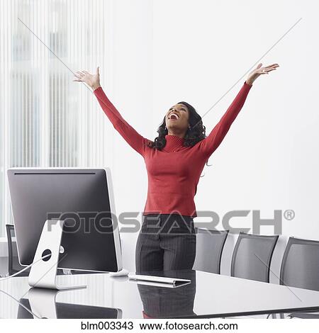 African businesswoman celebrating in office View Large Photo Image Stock Image - African businesswoman celebrating in office. Fotosearch