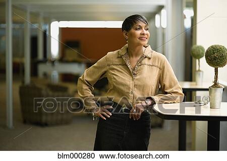 Stock Image - African businesswoman in modern office. Fotosearch