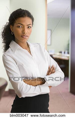 Stock Photo - African businesswoman with arms crossed. Fotosearch