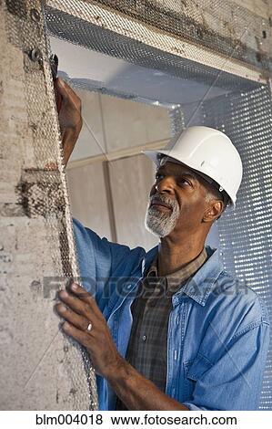 Stock Photo - African construction worker. Fotosearch