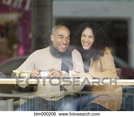 African couple drinking in coffee shop View Large Photo Image Stock Photograph - African couple drinking in coffee shop. Fotosearch
