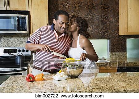 African couple fixing healthy meal in modern kitchen View Large Photo Image Stock Image - African couple fixing healthy meal in modern kitchen. Fotosearch