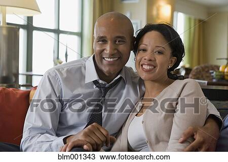 African couple hugging on sofa View Large Photo Image Stock Image - African couple hugging on sofa. Fotosearch